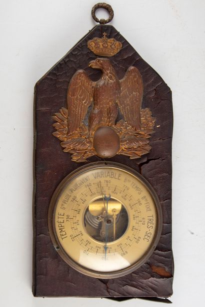 null Barometer of empire style covered with leather, decorated with a copper embossed.

H....