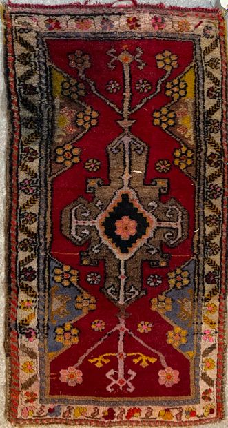 null Small carpet with a central medallion and flowers on a red field and a simple...
