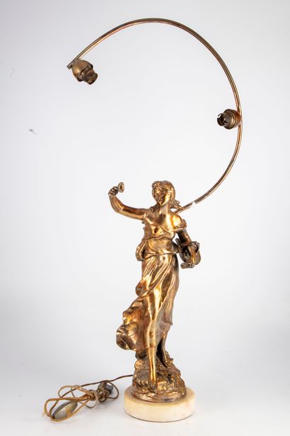 null Regula lamp with golden patina representing a young peasant woman 

Period 1920

H....