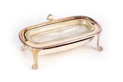 null Butter dish resting on four feet in the shape of lions' paws, glass lining 

L....