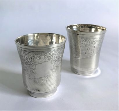 null Set of two flat-bottomed kettledrums in silver chased with a revolving frieze...