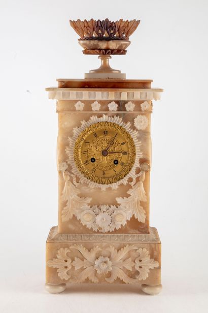 null Alabaster clock decorated with scrolls and garlands of flowers finely chased,...