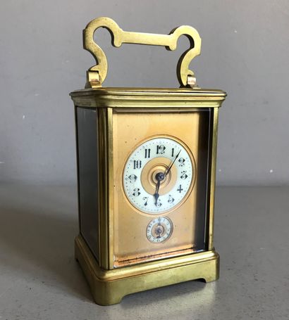 null Officer's clock in molded bronze and glass walls. Double dials on gilded bottom....