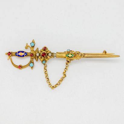  Brooch in the shape of sword in gilded metal decorated with fine stones and ena...