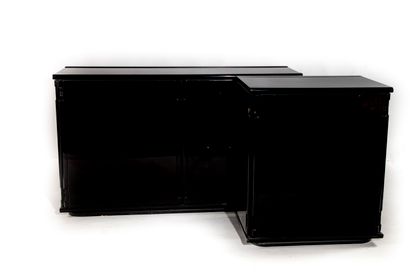 null Two low sideboards in black lacquered wood, one in enfilade opening by two leaves,...