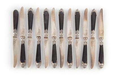 Twelve cheese knives, silver blades and ferrules,...