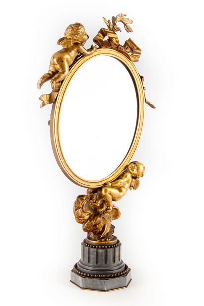 TAHAN House of TAHAN

Small psyche mirror of oval form, in chased and gilded bronze...