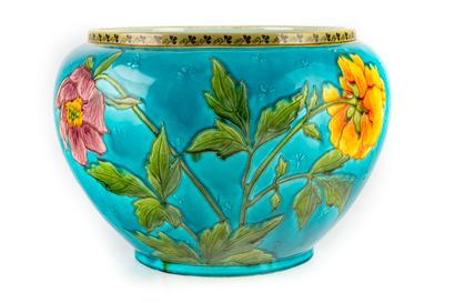  Important glazed earthenware planter with flowers on a blue background 
H. 26 c...