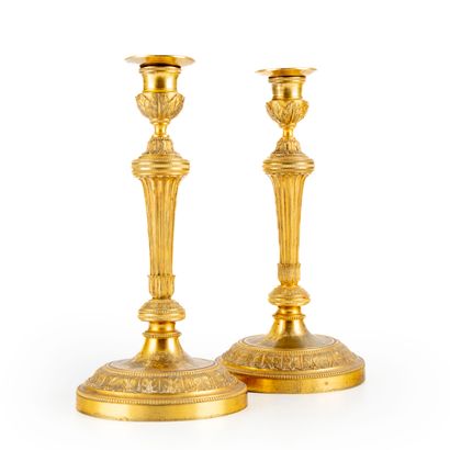 null Pair of large ormolu candlesticks molded and chased with leaves. Shaft with...