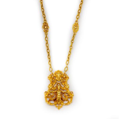 null 
Yellow gold necklace, the openwork pendant decorated with foliage and centered...