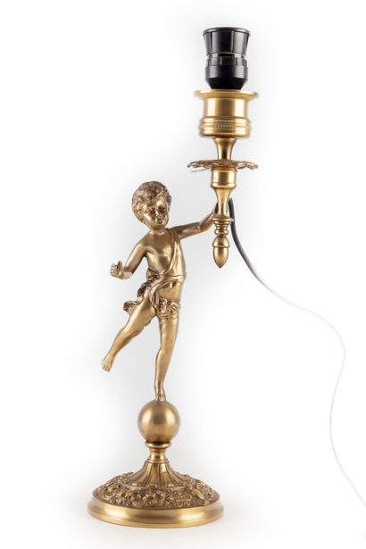  Gilded bronze lamp base, representing a putto on a globe 
Beginning of XXth century...