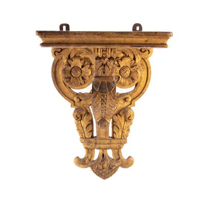 An openwork gilded wood console with chiseled...