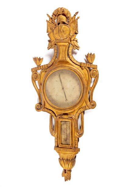 null Barometer-thermometer in gilded wood molded and carved with leaves, draperies...