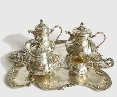 null Tea and coffee set in silver richly chased with Rocaille patterns and figured....