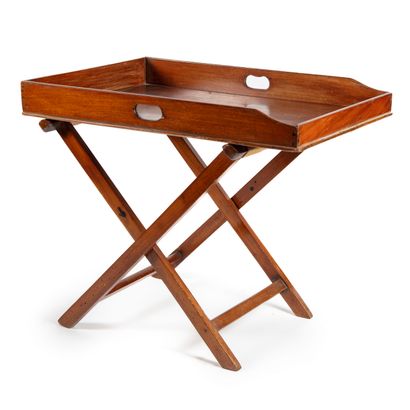 Mahogany folding marine table with a rectangular top resting on an "X" shaped base...