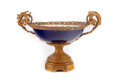In the taste of Sevres, 
Cup in blue enamelled...