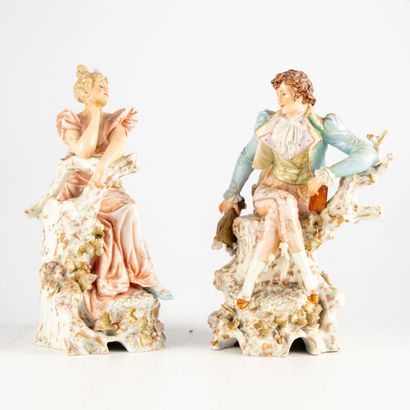 null Pair of polychrome enamelled porcelain subjects representing a couple of elegant...
