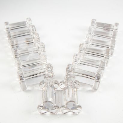 null Suite of fourteen glass knife holders with cloverleaf shaped uprights.