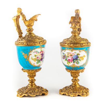 Pair of enamelled porcelain ewers decorated...