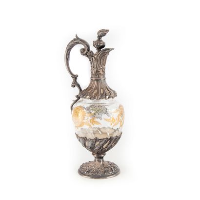 null Glass ewer with a silver plated metal frame of rocaille style 


H. 25 cm