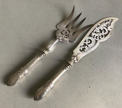 Openwork silver fish cover on a silver handle...