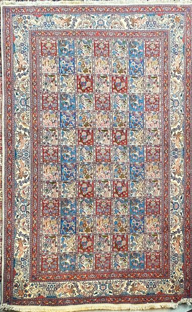 null Persian carpet type MOUD decorated on a background of red, blue and beige squares,...