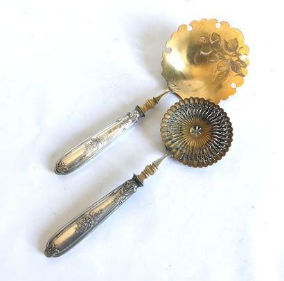 null Ice cream spoon and sugar spoon in gilt metal and silver handle molded and chased...