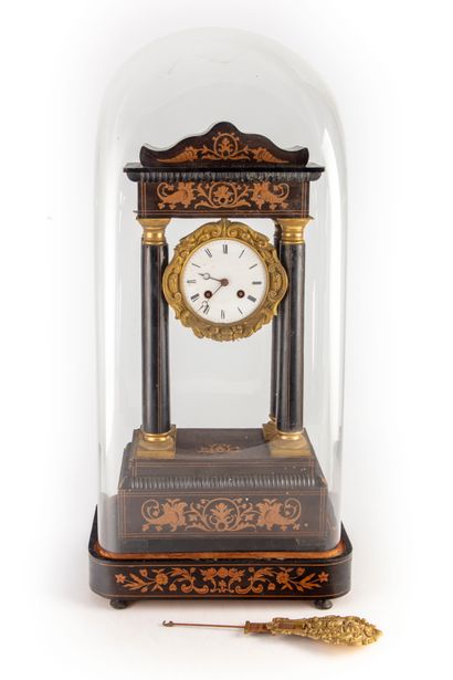 null Portico clock in blackened wood with columns and marquetry decoration. 

Napoleon...