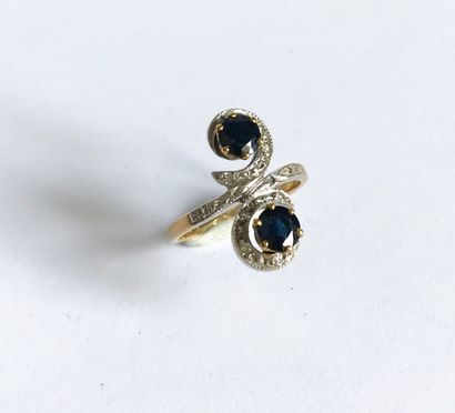 null You and Me ring in yellow and white gold set with two sapphires surrounded by...