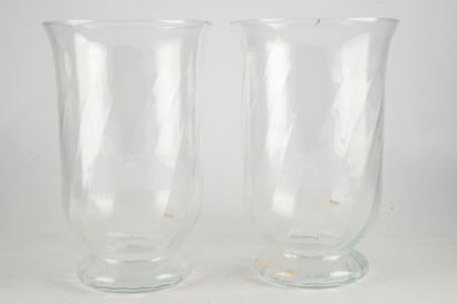 null Pair of large ribbed glass candle holders.