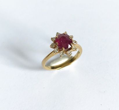 null Ring "Marguerite" with yellow gold setting adorned with a ruby surrounded by...