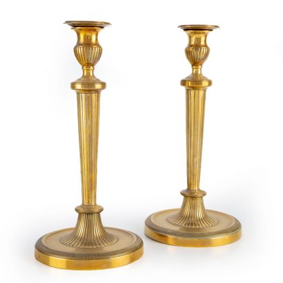 null Pair of gilt brass candlesticks, Louis XVI style 

H. 29 cm