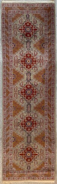 null Gallery carpet with five medallions on a cream background, and triple borders...