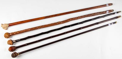 null Set of five canes:

-Cane with a stone knob in the shape of a moustachioed Chinese...