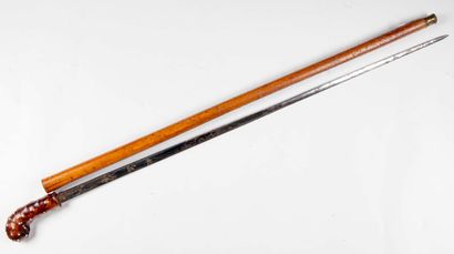 null Sword cane with damascened blade and Malacca rush shaft. Wooden pommel with...