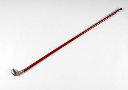 null Cane, the silver pommel of globular shape with lateral development, chased with...