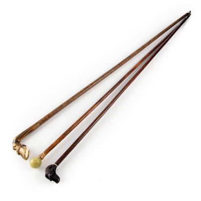 null Set of three canes, including : 

- Cane, the pommel in the shape of a horse's...