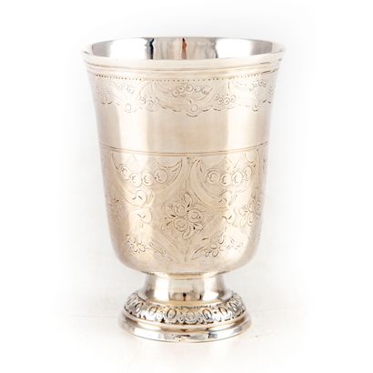 Silver tulip-shaped tumbler on pedestal with...