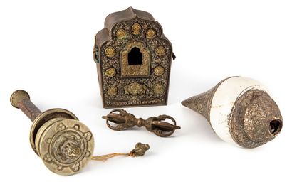 null Set of ritual objects: a small silver and gilded metal reliquary, a prayer wheel,...