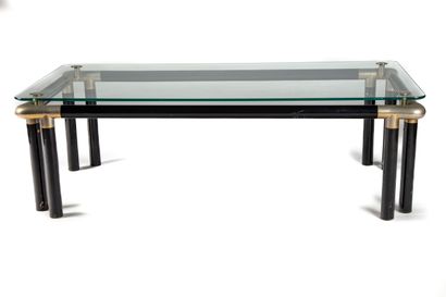 null Table basse en acier tubulaire et plateau en verre

Vers 1970 

H. : 37,5 cm...