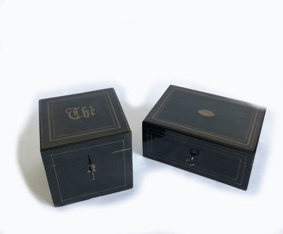 null Two boxes in blackened wood veneer and brass fillets. One bearing the inscription...