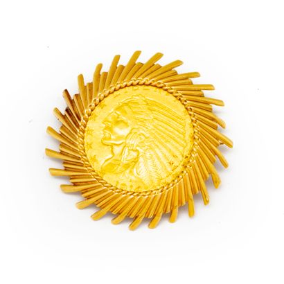 null Dollar 1914 mounted in a yellow gold brooch

Weight; 14 g.