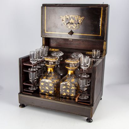 null Liqueur cabinet in blackened wood decorated with inlaid brass nets, revealing...