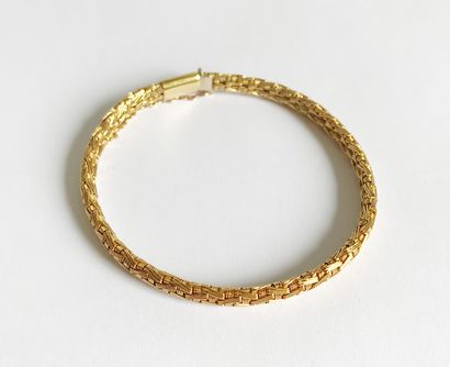 Bracelet en or jaune (750e) à mailles souples...