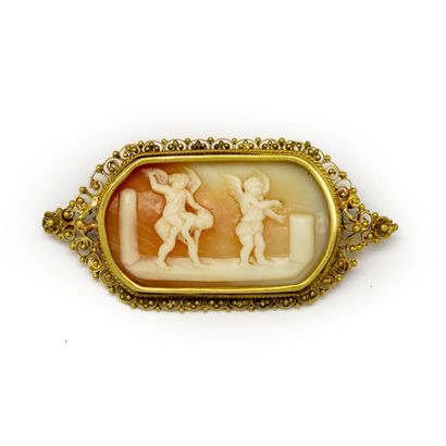 null Cameo brooch representing a scene of putti surrounded by a filigree pattern...
