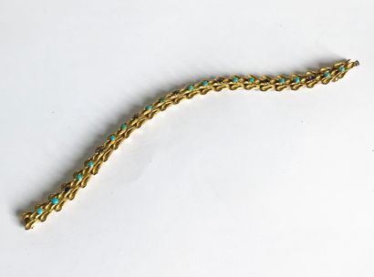 null Bracelet articulé en or jaune à maillons en forme de feuilles sertis en alterné...