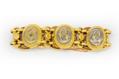  Bracelet en or jaune orné de médaillons, à l'intérieur motifs au chiffre en cheveux...