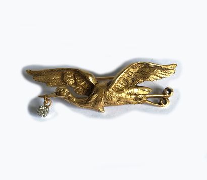 Yellow gold (18K) brooch in the shape of...