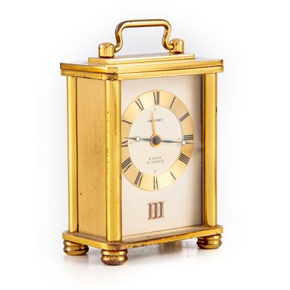 CHAUMET House CHAUMET 

Table clock in gilded metal. Cabinet resting on four columns...