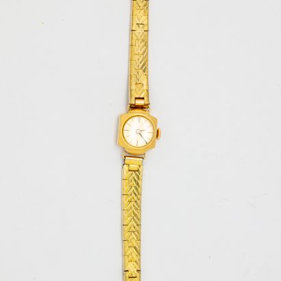 null Lady's watch, yellow gold dial, gilt metal bracelet 

Gross weight : 21 g